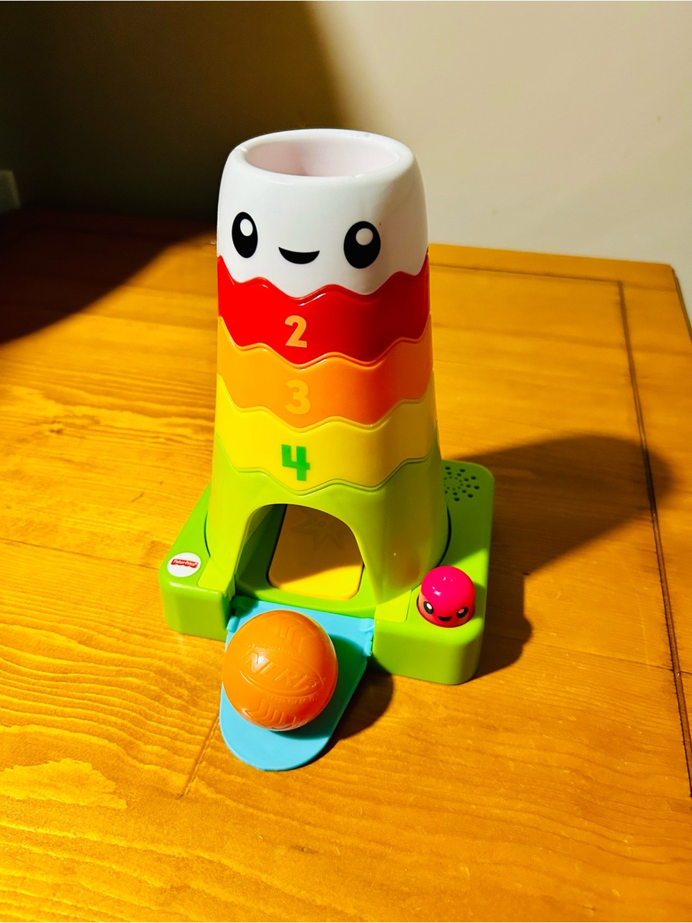 Fisher-Price Interactive Stack & Roll Rainbow Tower Toy